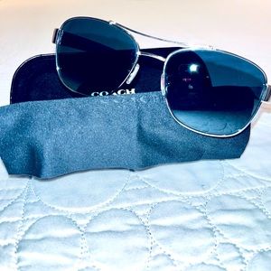 Coach sunglasses.  Blue with silver accents.